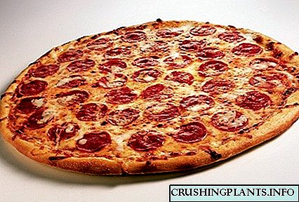 Kif tagħmel pizza klassika fid-dar